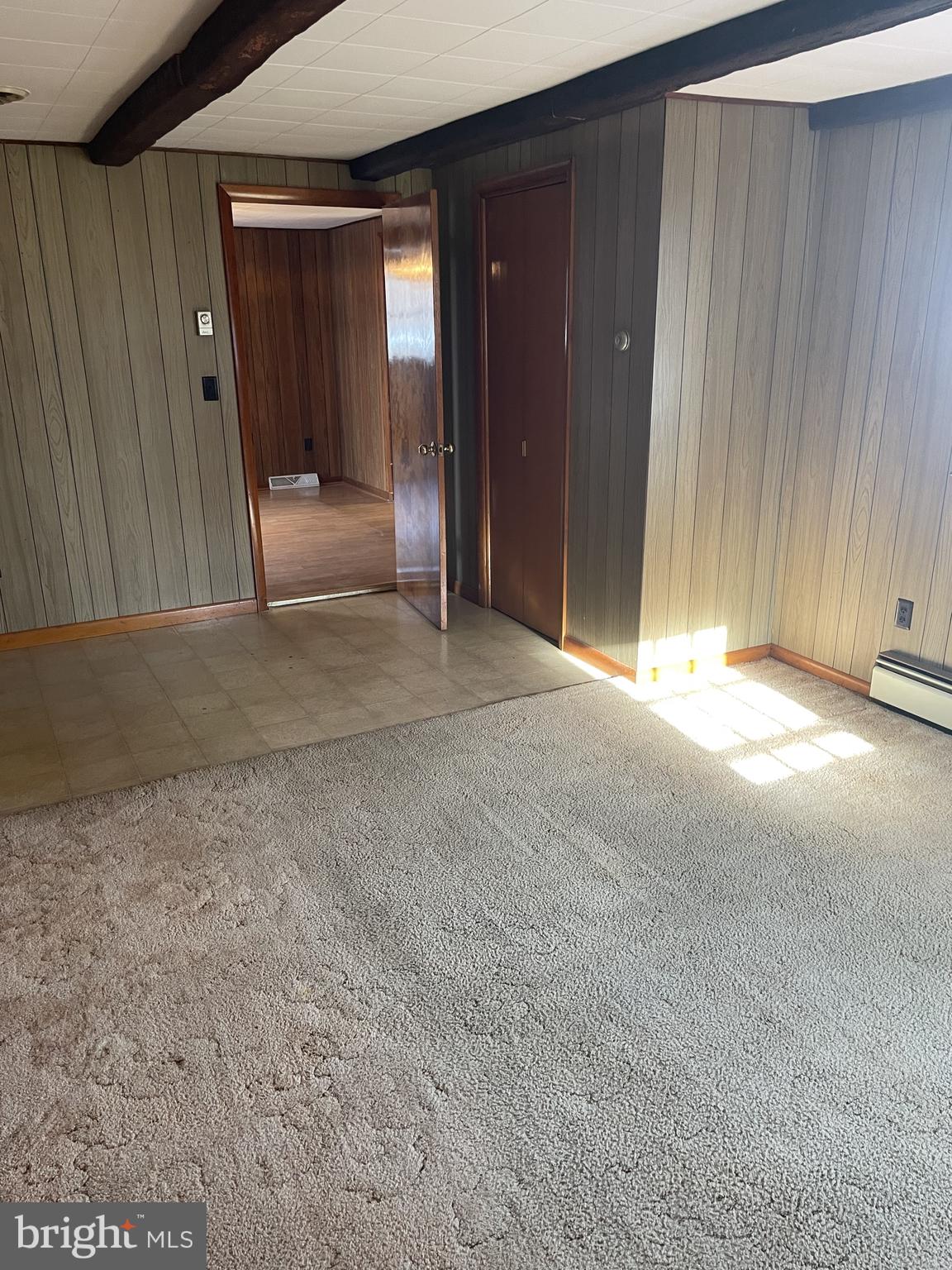 4420 West Denneys Road Dover, DE 19904 - Photo 13 of 36 a view of a hallway with wooden shelves