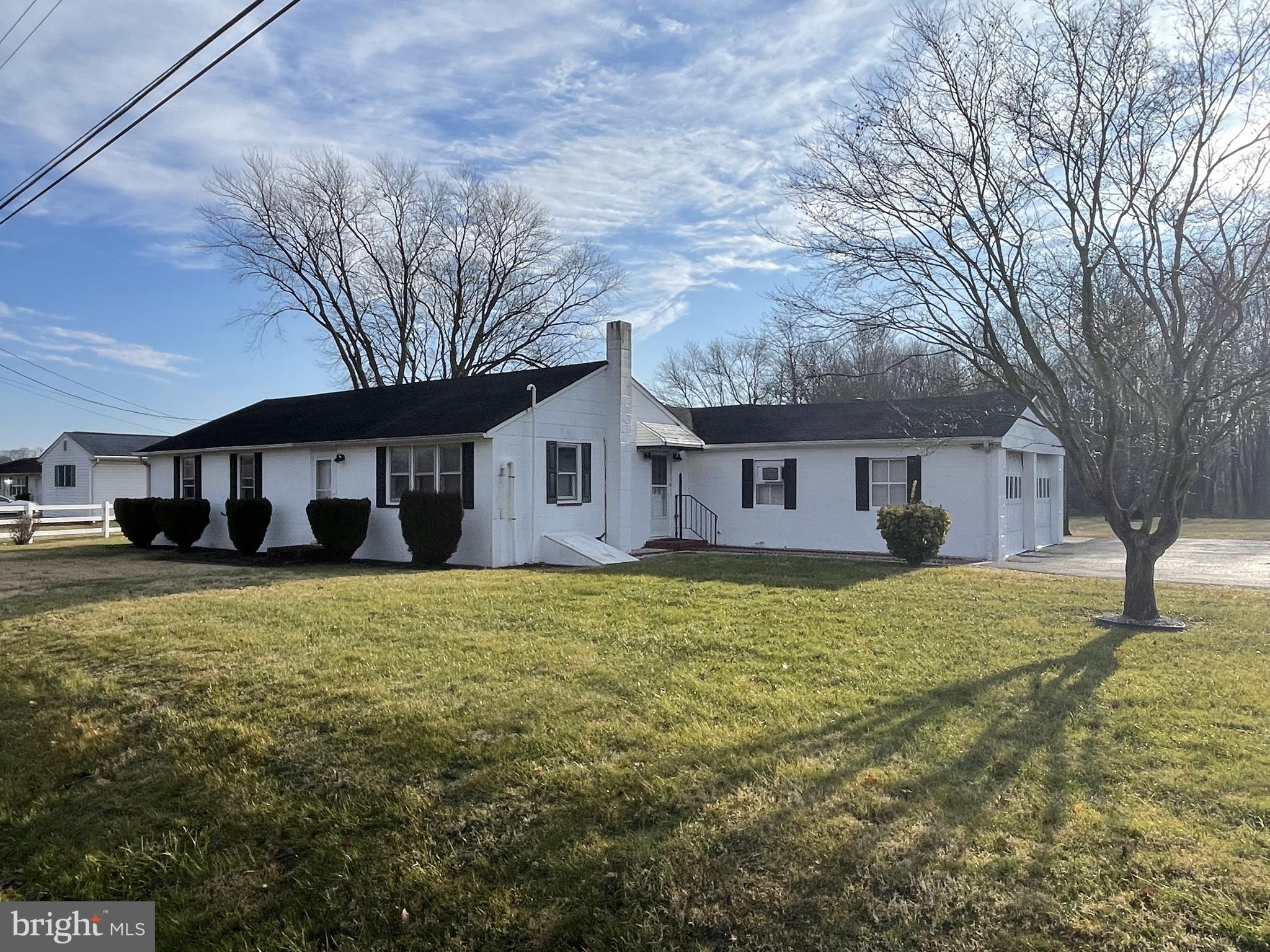 4420 West Denneys Road Dover, DE 19904 - Photo 2 of 36 a front view of a house with a yard