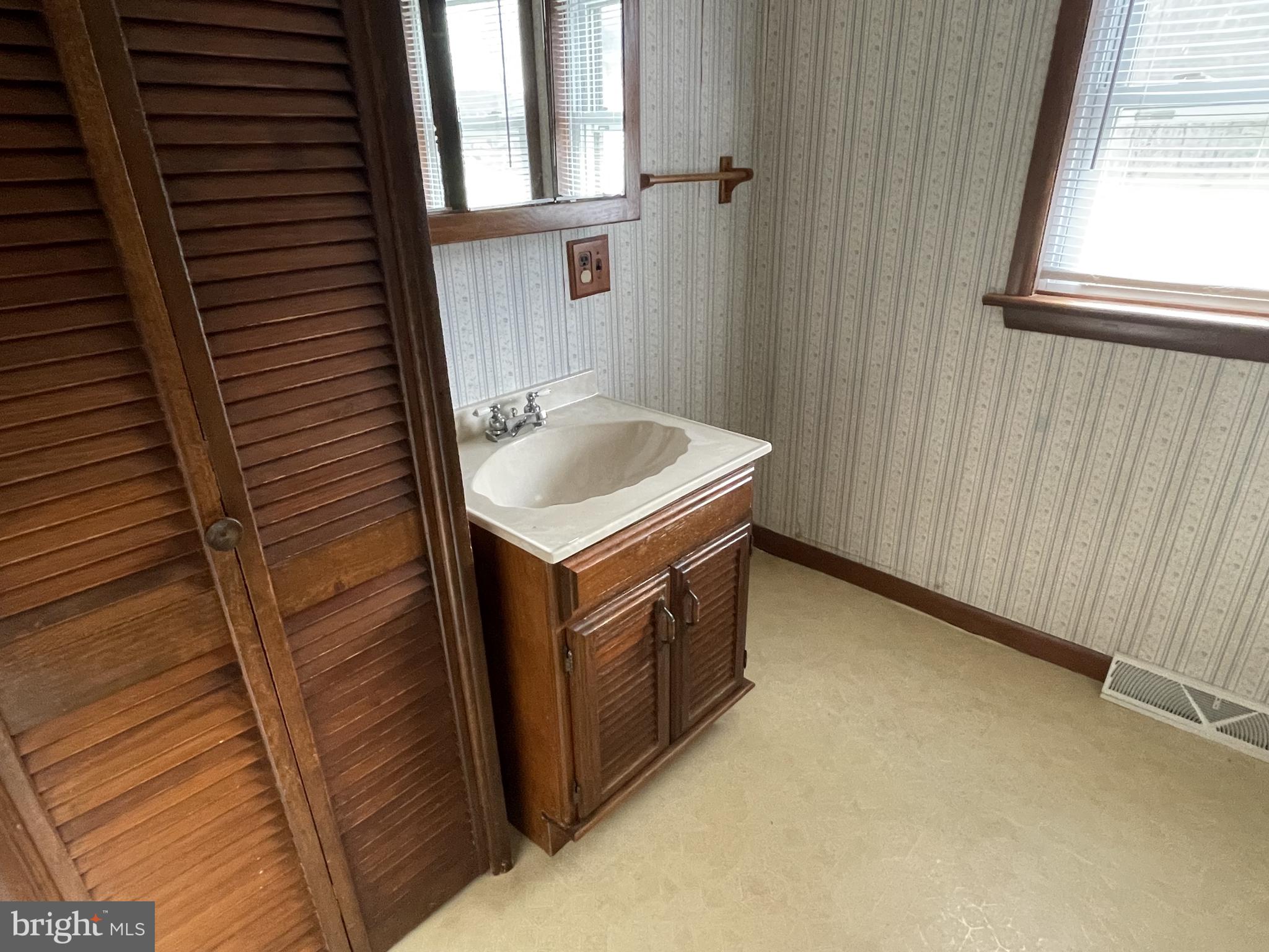 4420 West Denneys Road Dover, DE 19904 - Photo 30 of 36 a utility room with a sink a washer and dryer