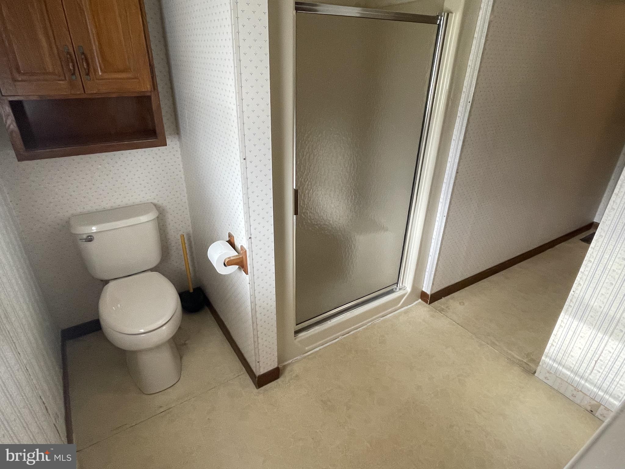 4420 West Denneys Road Dover, DE 19904 - Photo 33 of 36 a bathroom with a toilet and a sink