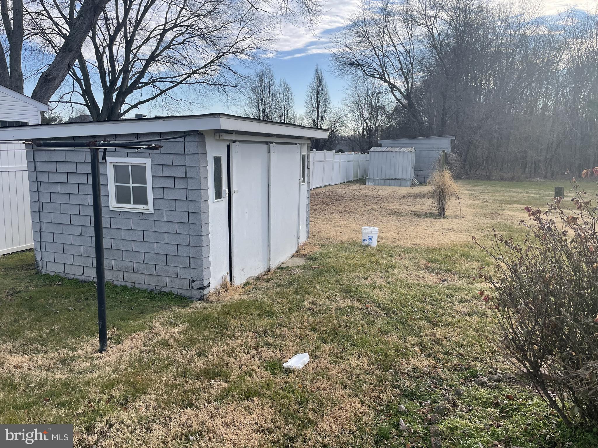 4420 West Denneys Road Dover, DE 19904 - Photo 34 of 36 a backyard of a house