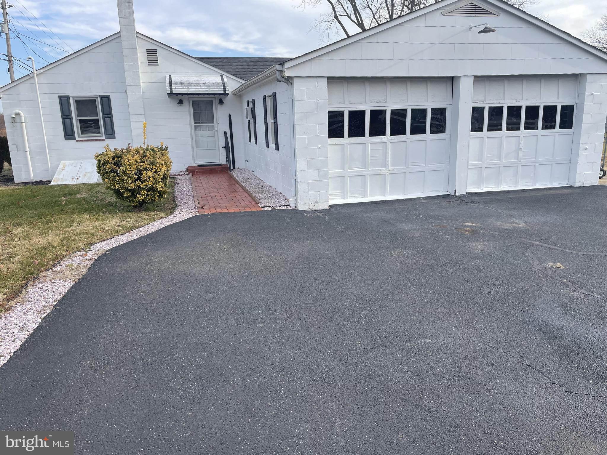 4420 West Denneys Road Dover, DE 19904 - Photo 4 of 36 a view of a house with a yard