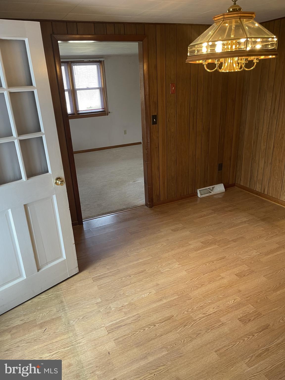 4420 West Denneys Road Dover, DE 19904 - Photo 9 of 36 a view of an empty room with a mirror