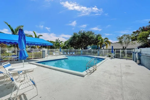 a view of a lake with a house in the background