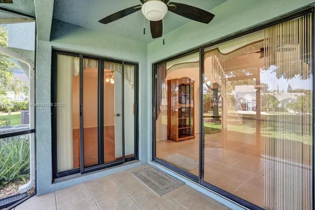 a view of a house with a yard and plants