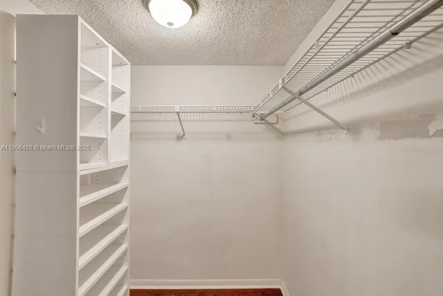 a bathroom with a sink a large mirror and a window