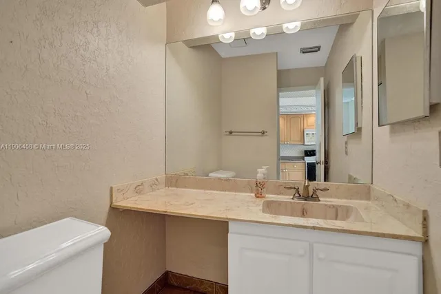 a room with wooden floor and white walls