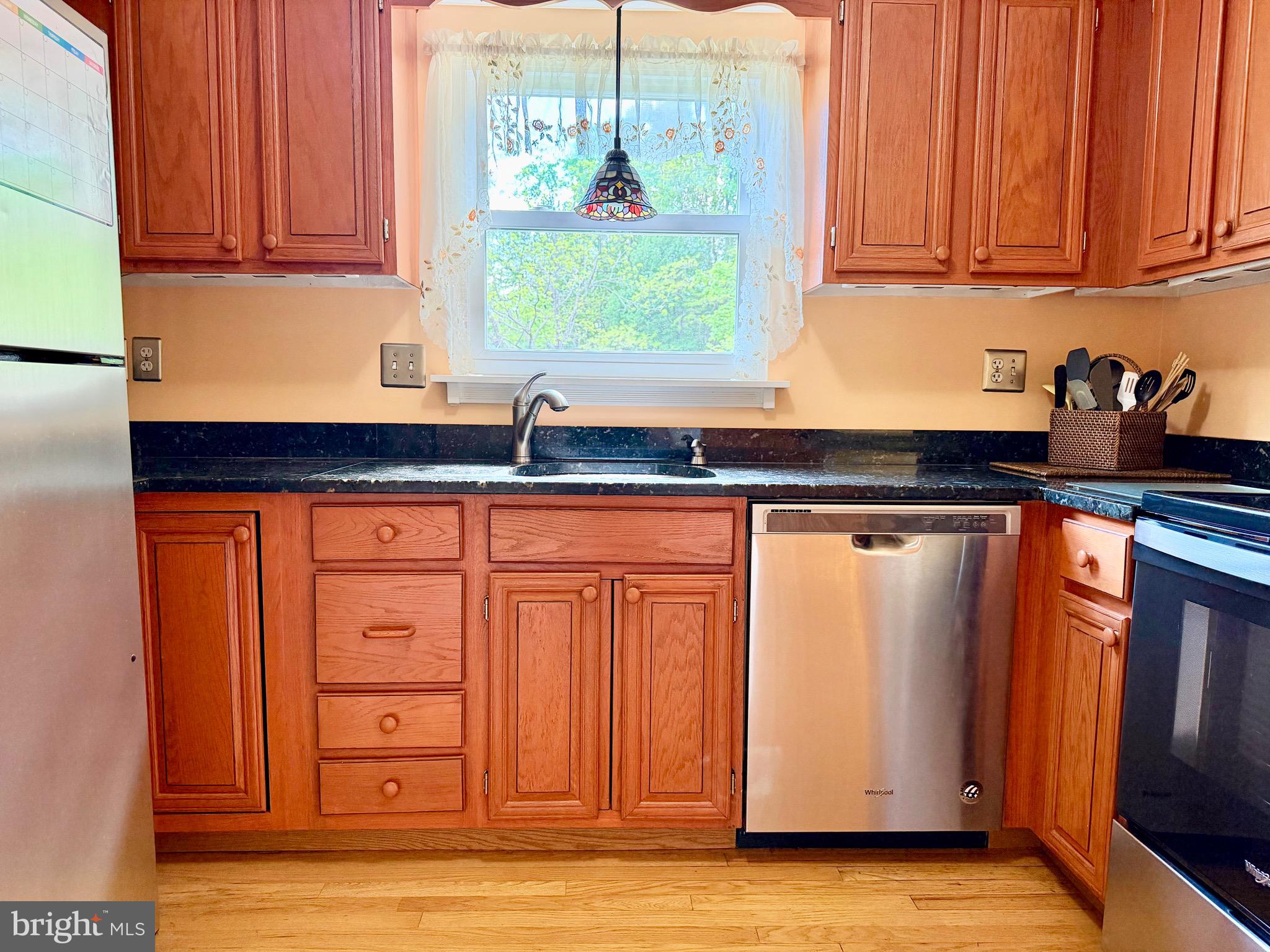 2712 Parallel Path Abingdon, MD 21009 - Photo 11 of 37 a kitchen with granite countertop cabinets and window
