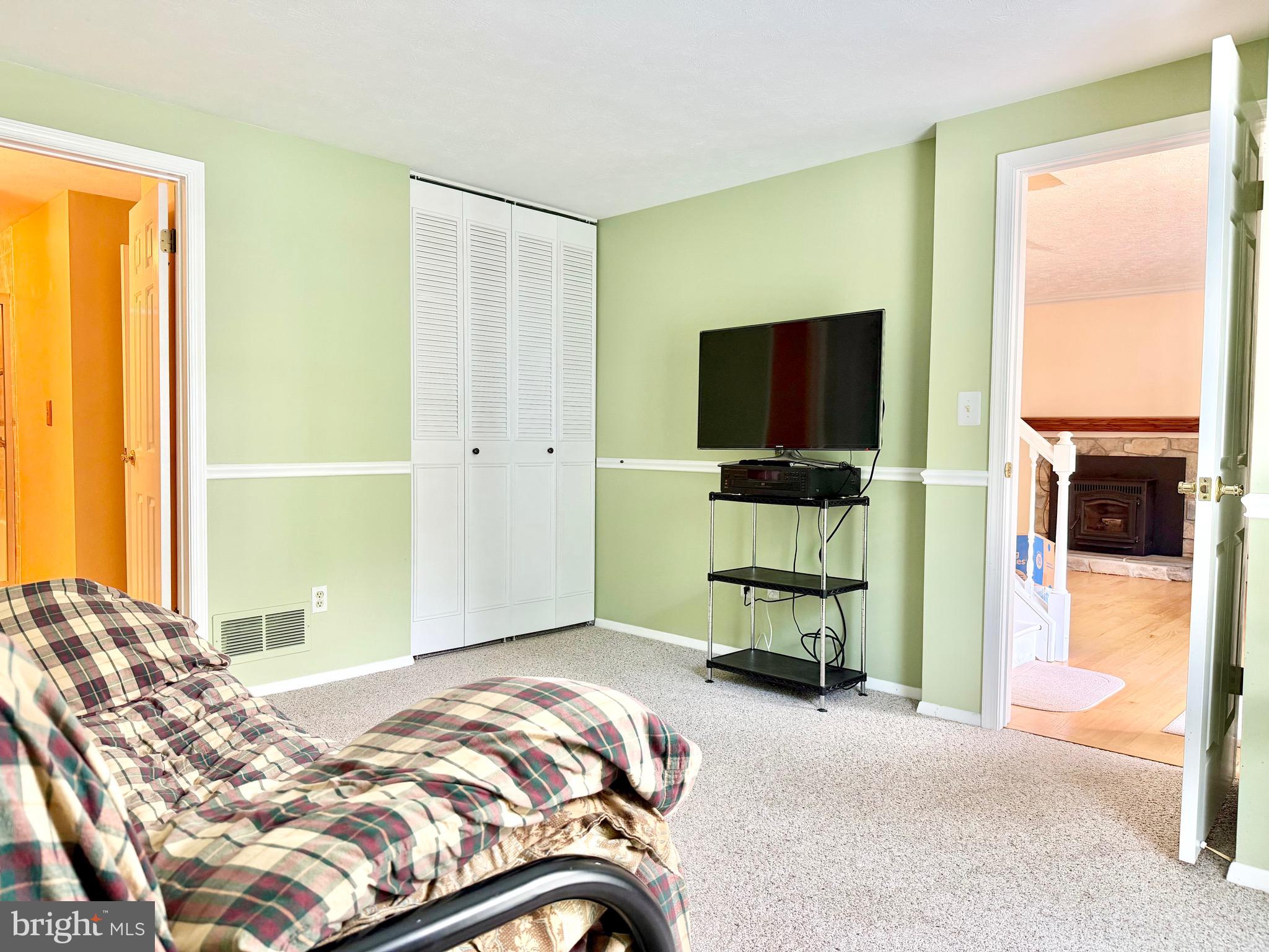 2712 Parallel Path Abingdon, MD 21009 - Photo 14 of 37 a bedroom with a bed and flat screen tv