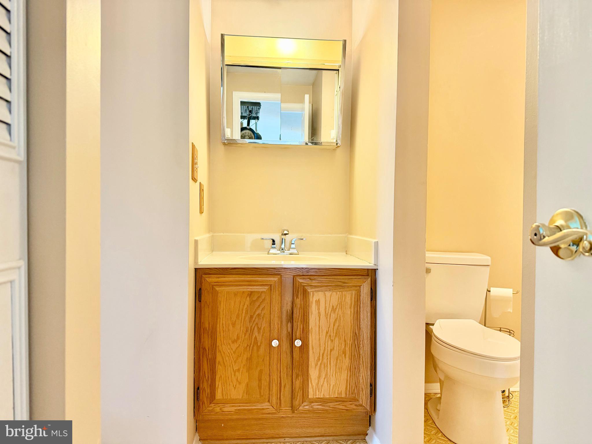 2712 Parallel Path Abingdon, MD 21009 - Photo 16 of 37 a bathroom with a sink and a mirror