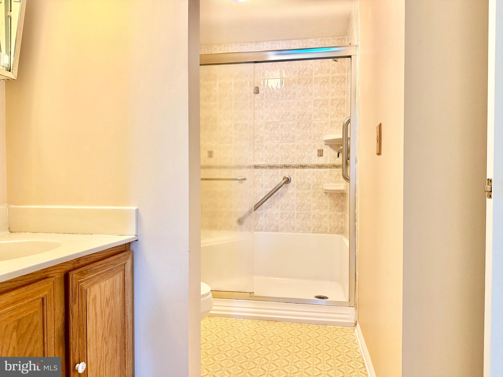 2712 Parallel Path Abingdon, MD 21009 - Photo 17 of 37 a bathroom with a glass shower door
