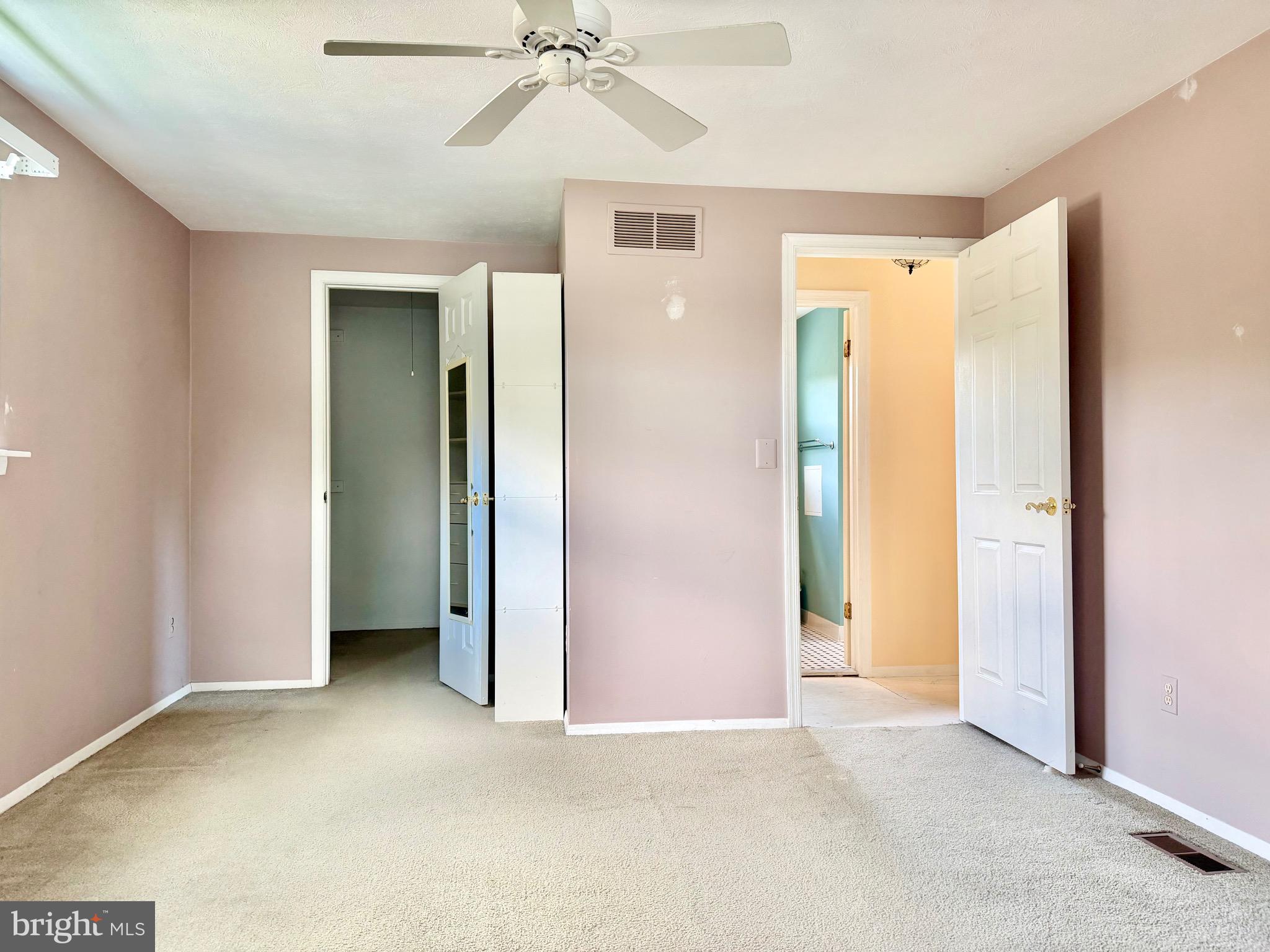 2712 Parallel Path Abingdon, MD 21009 - Photo 21 of 37 an empty room with closet and a chandelier fan