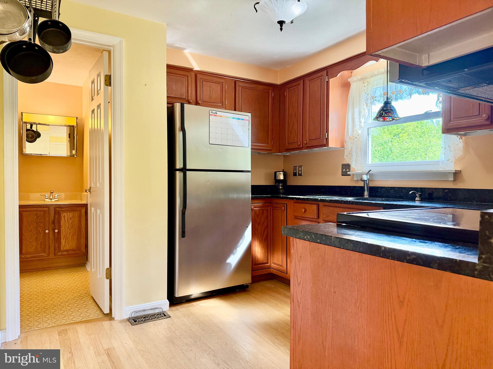 2712 Parallel Path Abingdon, MD 21009 - Photo 10 of 37 a kitchen with stainless steel appliances granite countertop a refrigerator a sink and a stove
