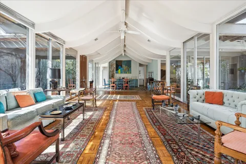 a living room with lots of furniture and a rug