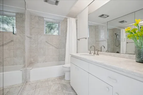 a view of a livingroom with furniture and a window