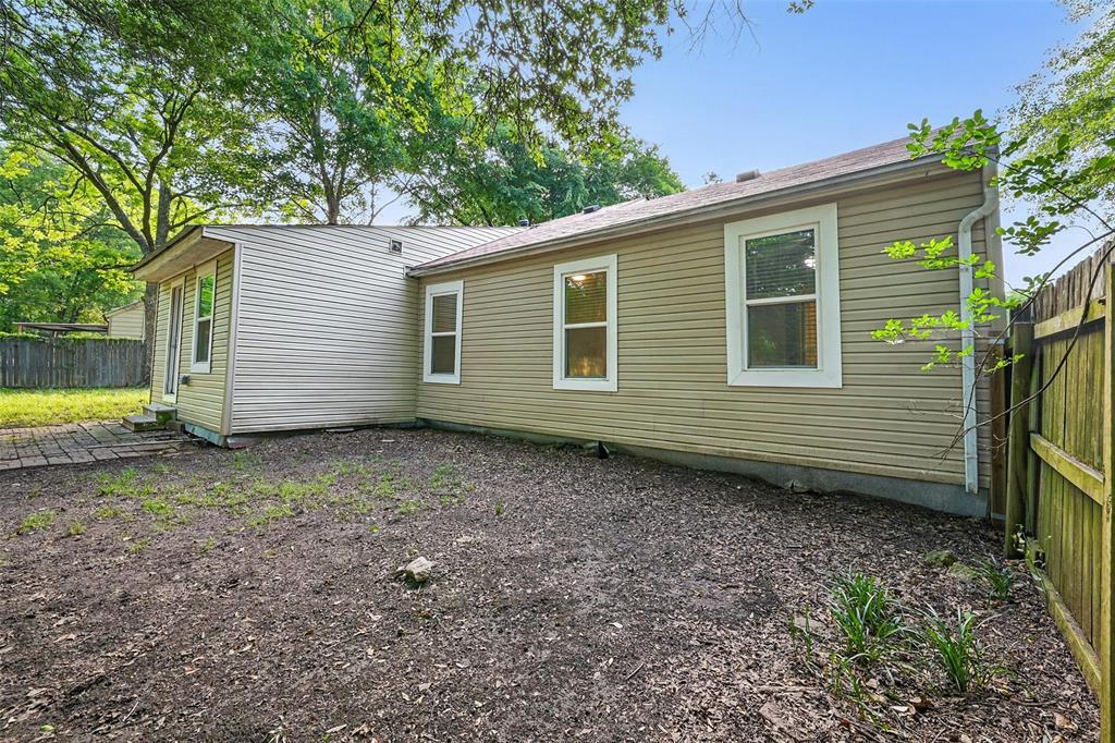 1003 Pecan Avenue Greenville, TX 75401 - Photo 21 of 25 a view of a backyard with a garden