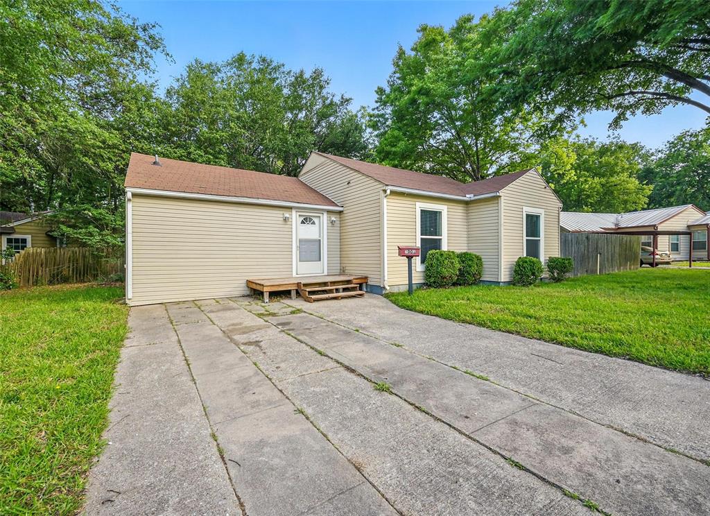 1003 Pecan Avenue Greenville, TX 75401 - Photo 25 of 25 a view of a house with a yard and large tree