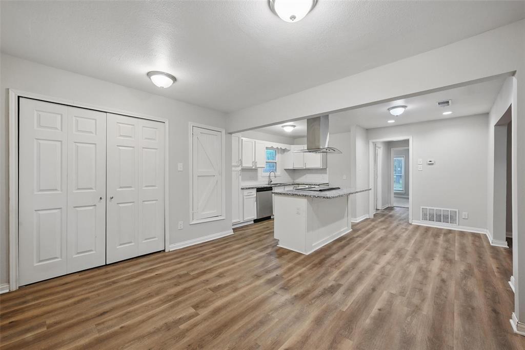 1003 Pecan Avenue Greenville, TX 75401 - Photo 3 of 25 a view of kitchen with wooden floor