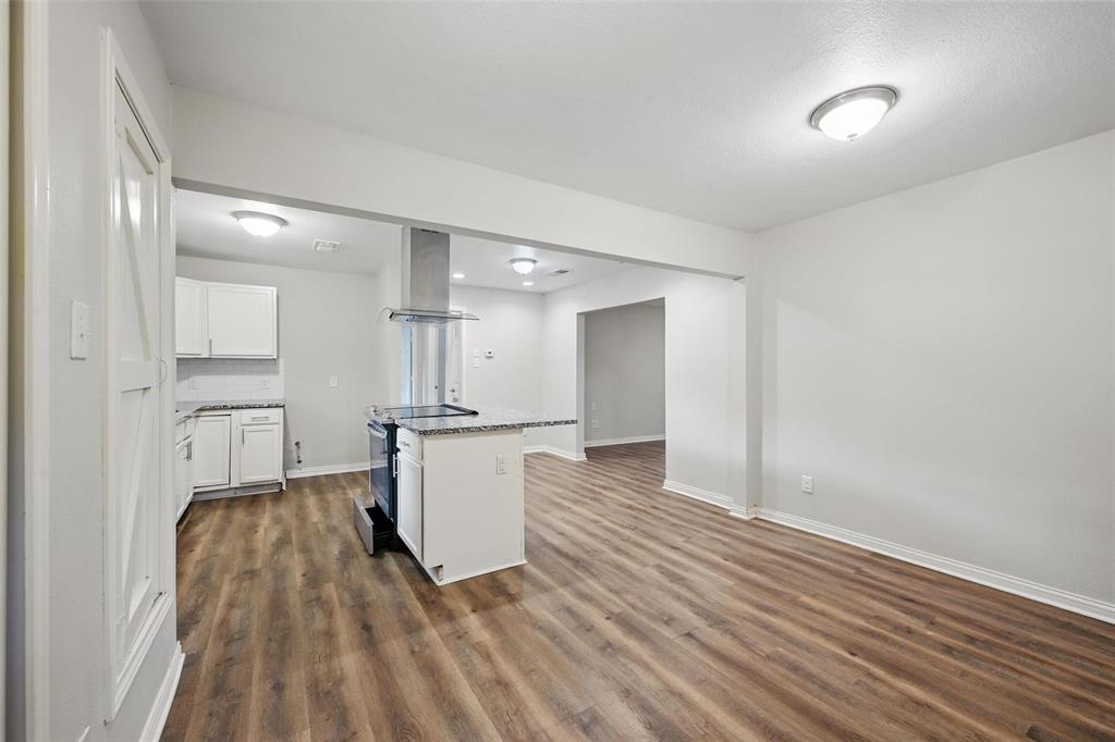1003 Pecan Avenue Greenville, TX 75401 - Photo 9 of 25 a view of kitchen with wooden floor