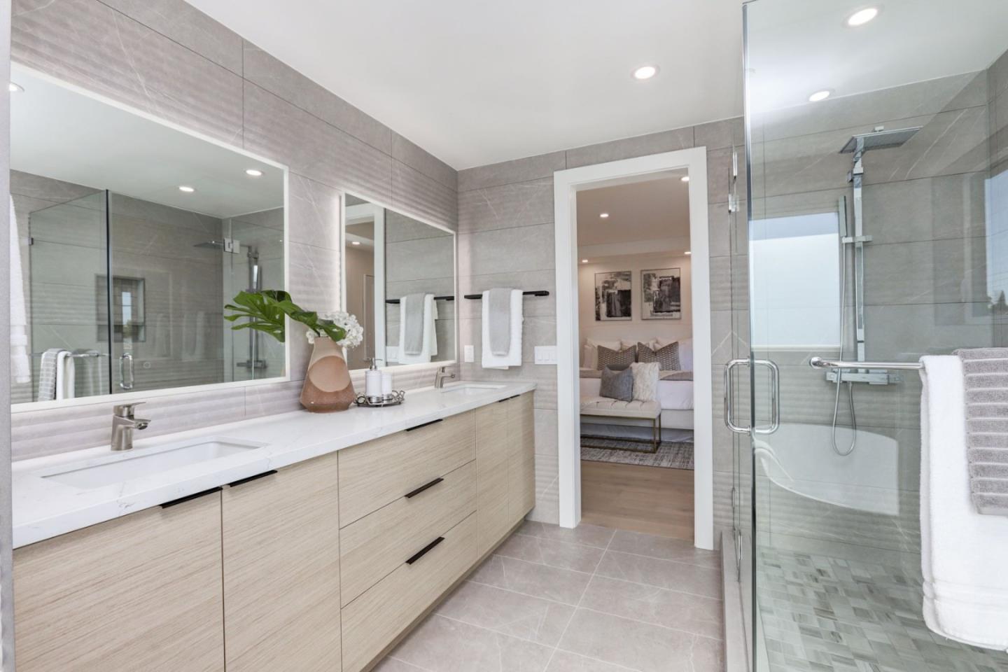 3107 Greer Road Palo Alto, CA 94303 - Photo 11 of 20 a bathroom with a granite countertop sink two mirror and shower