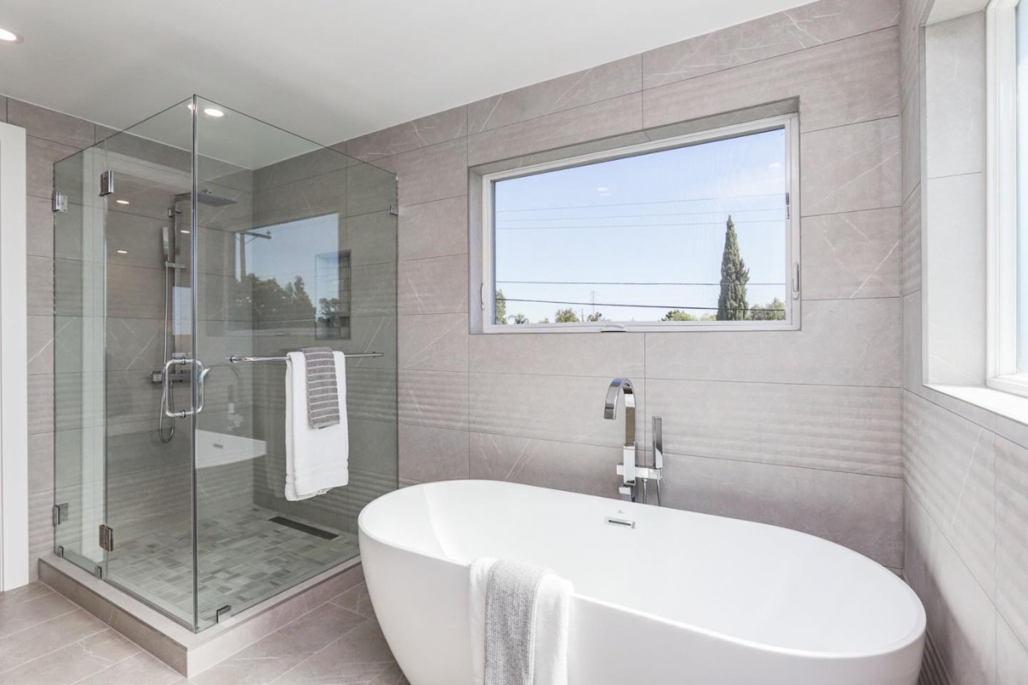 3107 Greer Road Palo Alto, CA 94303 - Photo 12 of 20 a white bath tub sitting next to a bathroom sink
