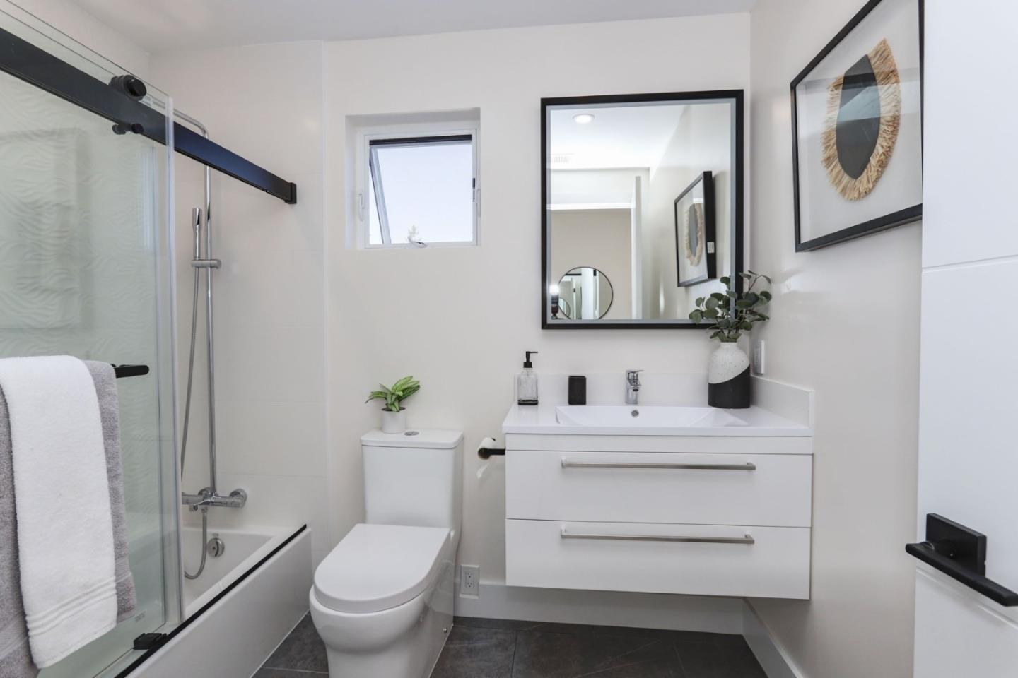 3107 Greer Road Palo Alto, CA 94303 - Photo 16 of 20 a bathroom with a toilet sink and mirror