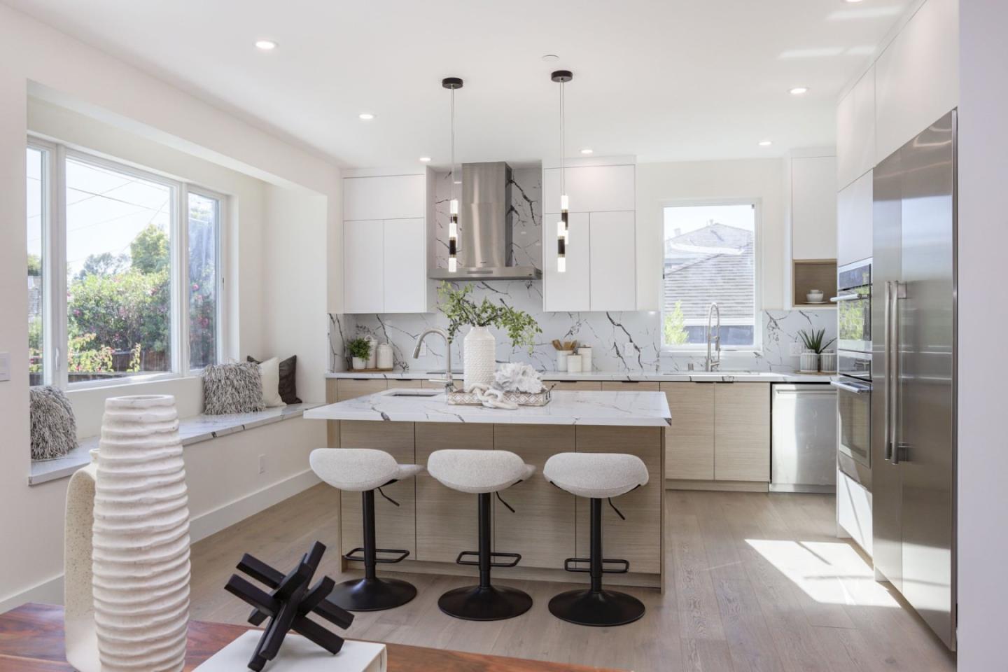 3107 Greer Road Palo Alto, CA 94303 - Photo 4 of 20 a kitchen with stainless steel appliances kitchen island granite countertop a sink and cabinets