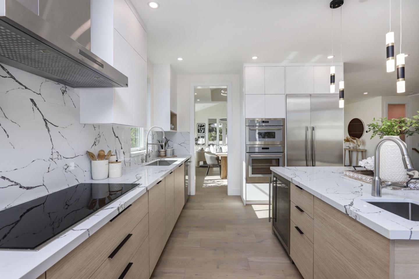 3107 Greer Road Palo Alto, CA 94303 - Photo 5 of 20 a large kitchen with stainless steel appliances kitchen island granite countertop a sink counter space cabinets and a large window