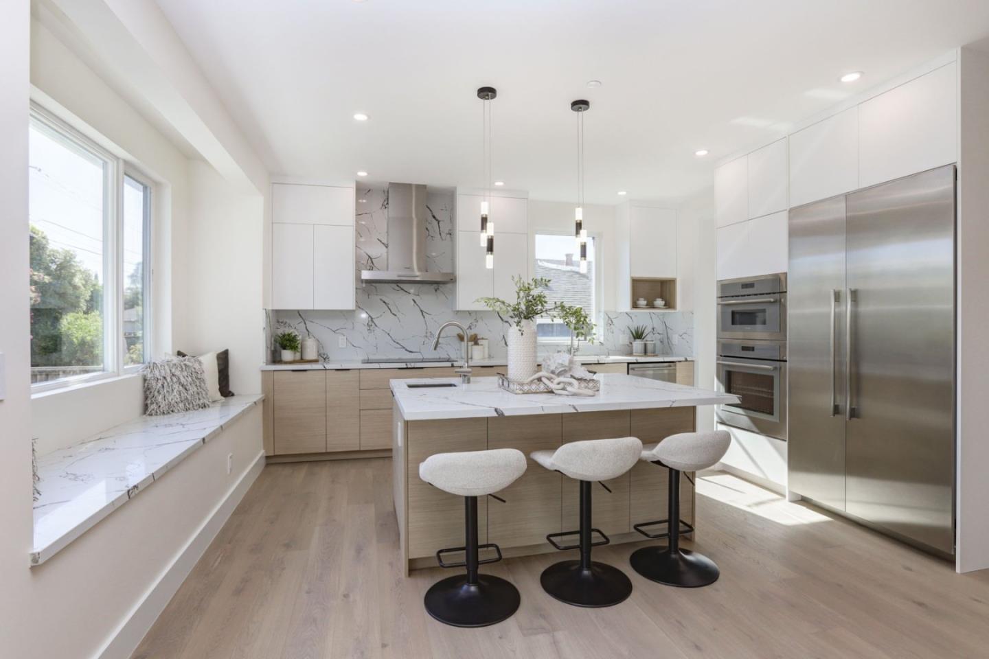 3107 Greer Road Palo Alto, CA 94303 - Photo 6 of 20 a kitchen with stainless steel appliances kitchen island granite countertop a sink and cabinets