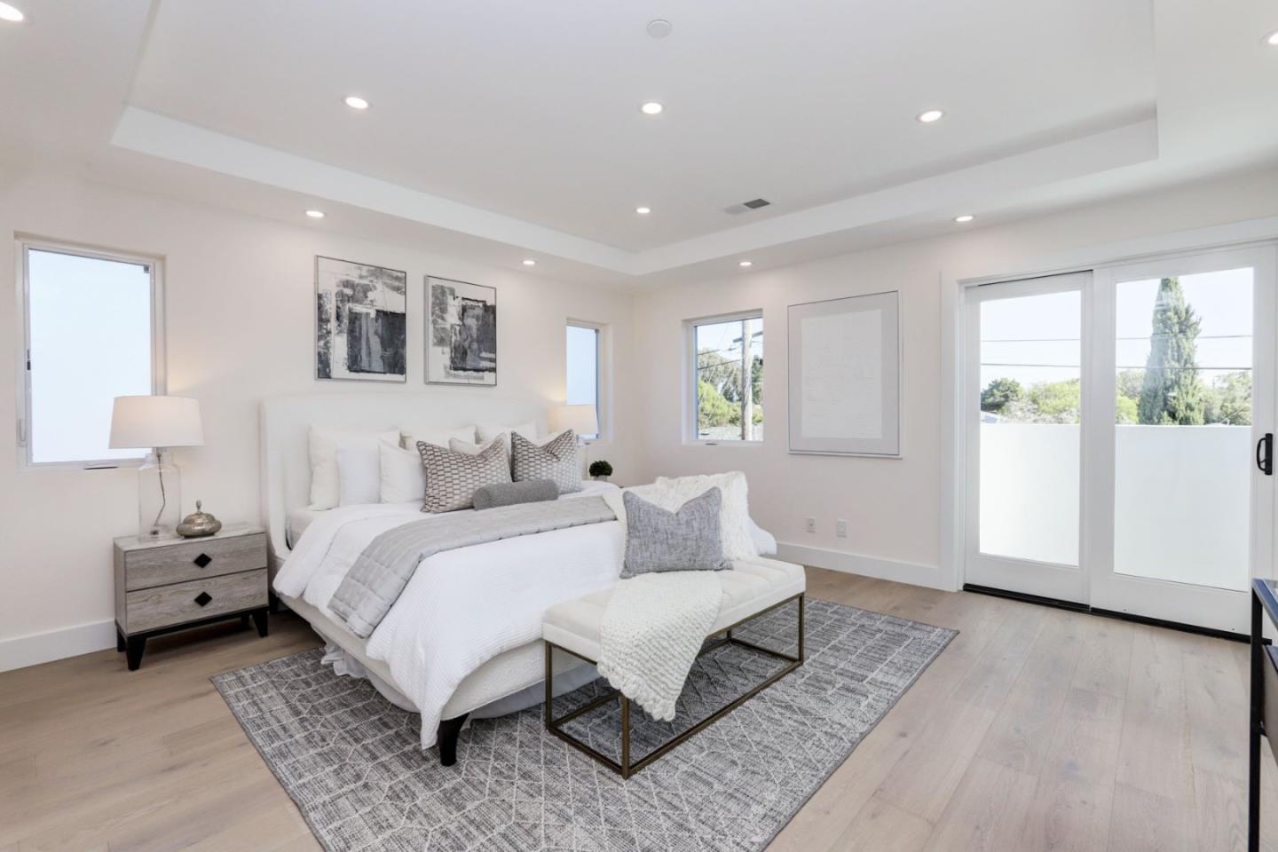 3107 Greer Road Palo Alto, CA 94303 - Photo 9 of 20 a spacious bedroom with a large bed and a window