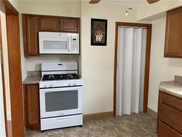 a kitchen with a stove and a microwave