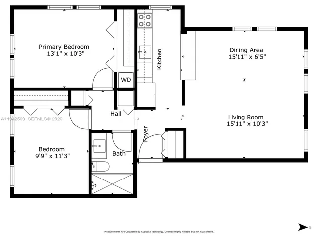 a front view of a house with a tree