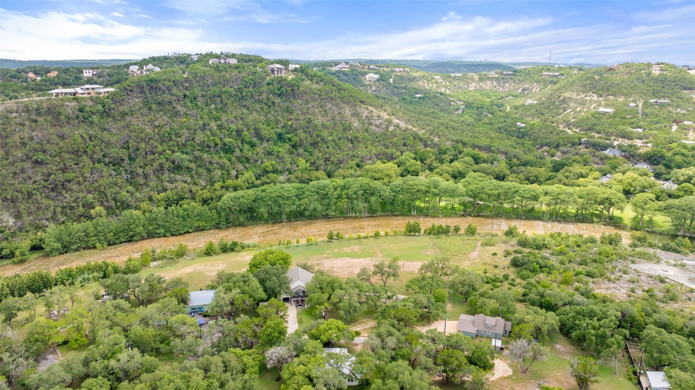 200 Rim Road Wimberley, TX 78676 - Photo 7 of 25 Aerial view of property and surrounding area with a heavily wooded area and mountains