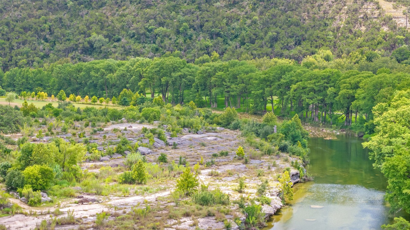 200 Rim Road Wimberley, TX 78676 - Photo 8 of 25 This lot is private and amazing hill views and trees along with ultimate waterfrontage.