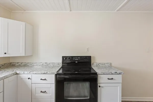 a stove top oven sitting inside of a kitchen