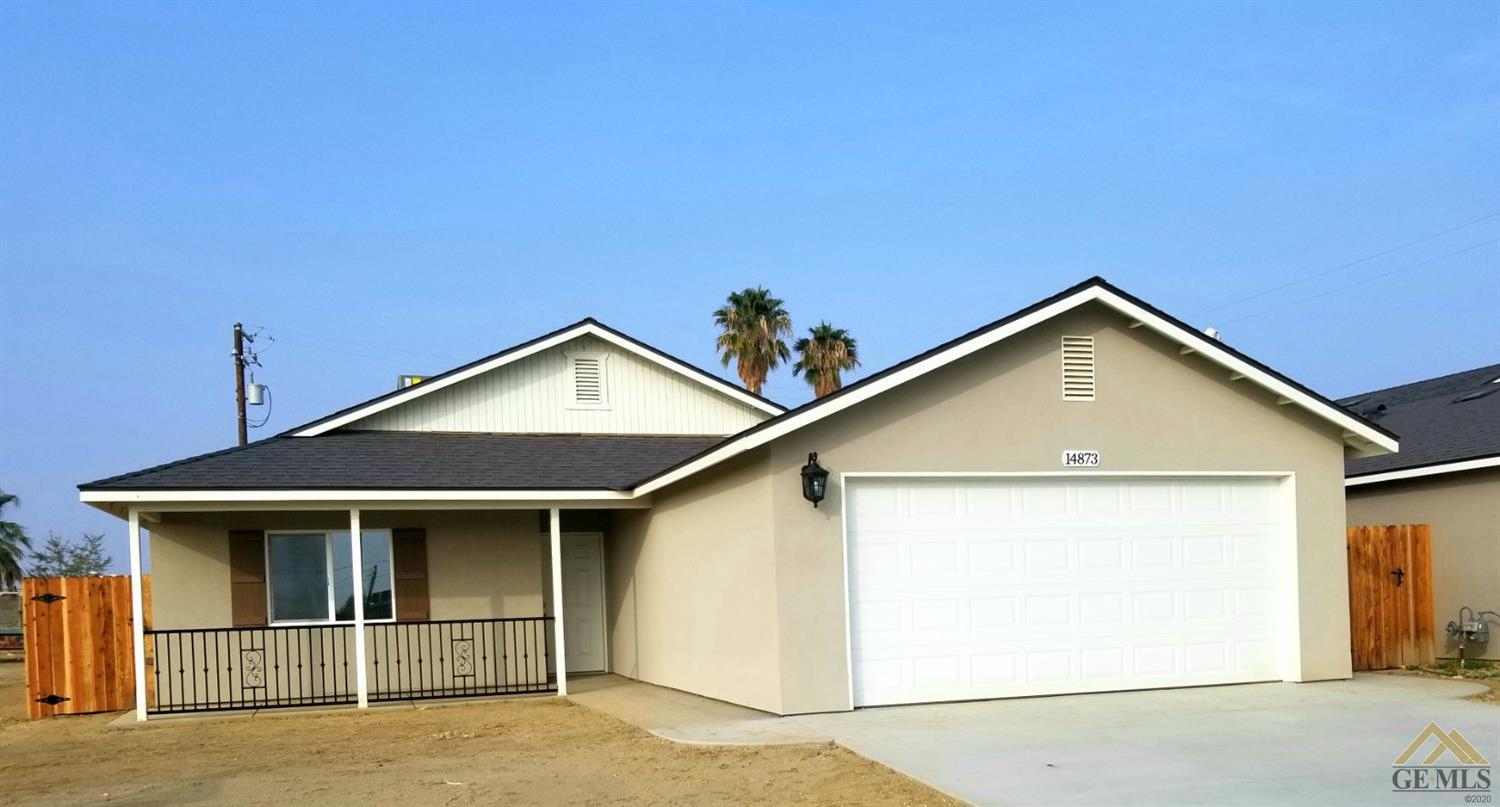 a front view of a house with garage