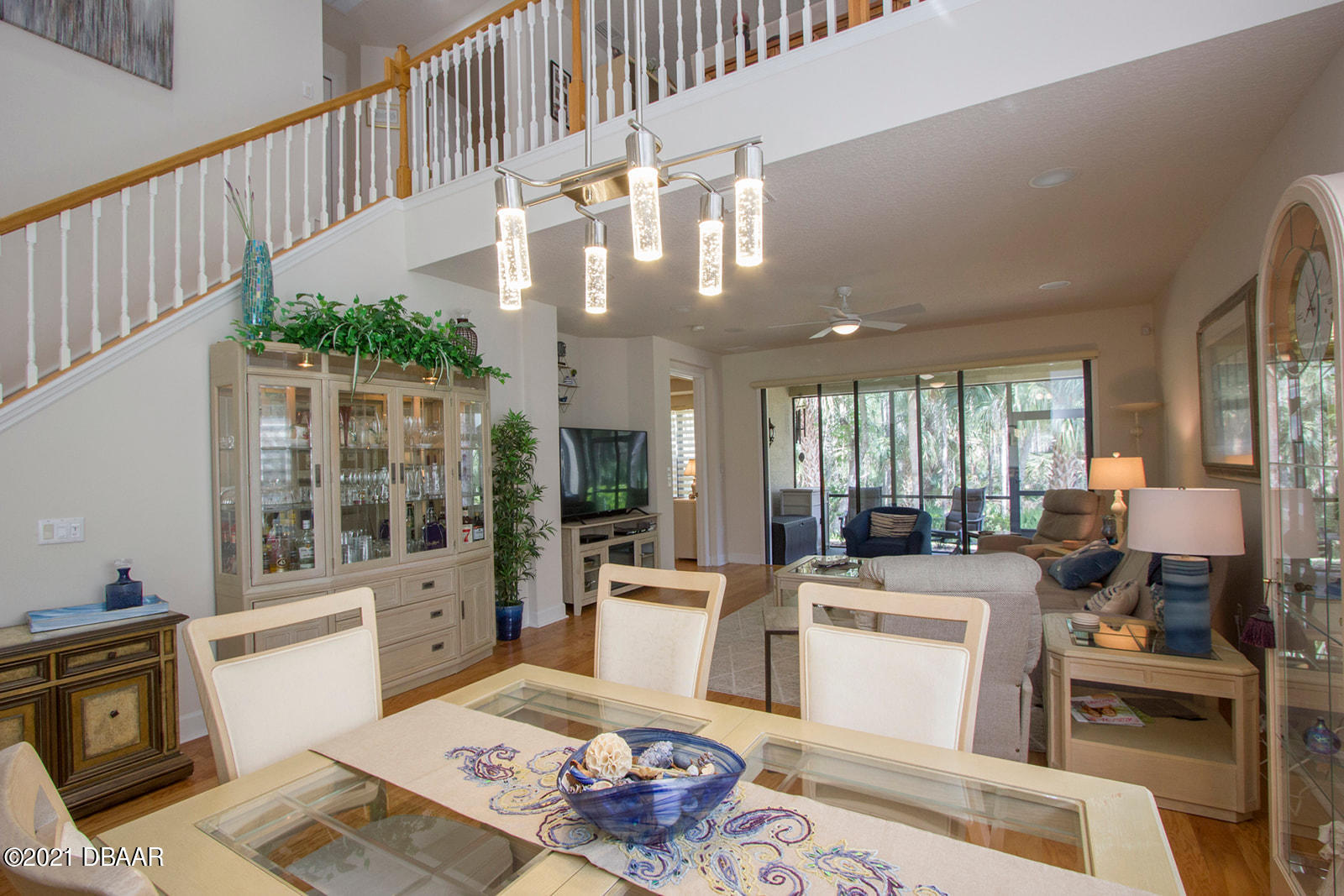751 Cobblestone Way Ormond Beach, FL 32174 - Photo 17 of 63 a living room with furniture and a chandelier