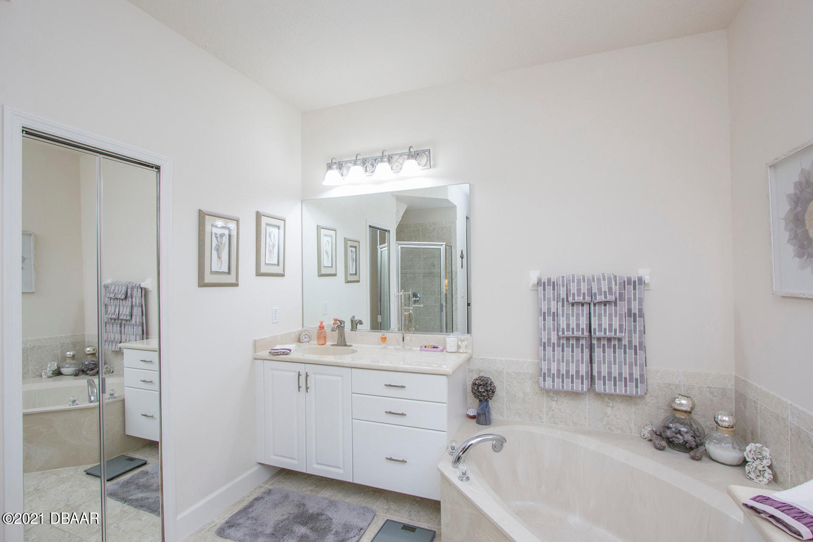 751 Cobblestone Way Ormond Beach, FL 32174 - Photo 28 of 63 a bathroom with a tub sink and mirror