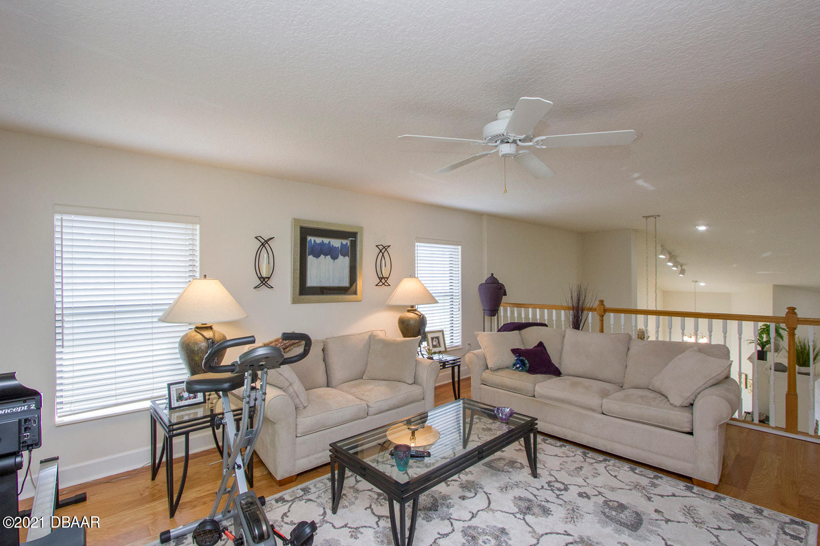 751 Cobblestone Way Ormond Beach, FL 32174 - Photo 34 of 63 a living room with furniture a chandelier and a rug