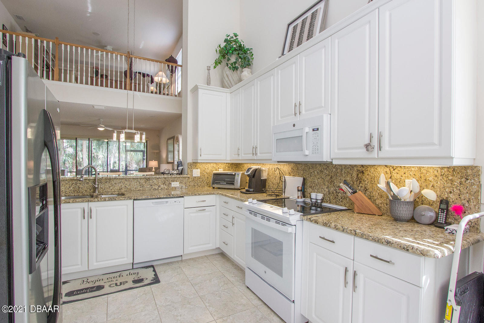 751 Cobblestone Way Ormond Beach, FL 32174 - Photo 4 of 63 a kitchen with granite countertop a sink and cabinets