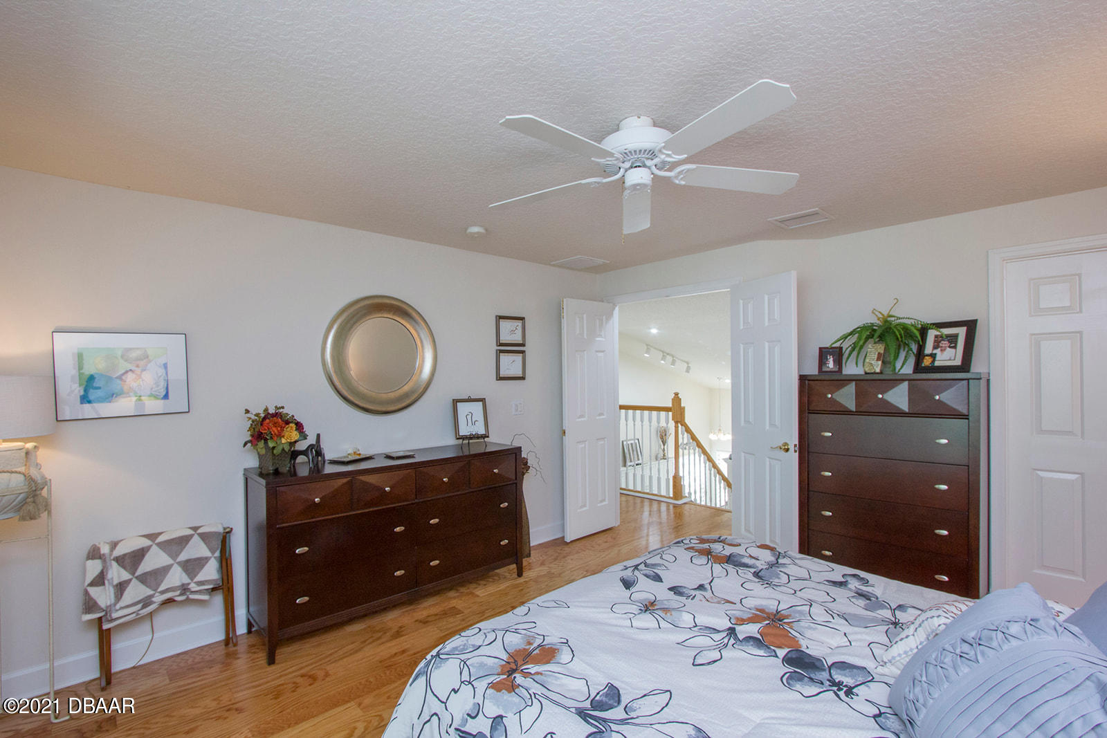 751 Cobblestone Way Ormond Beach, FL 32174 - Photo 41 of 63 a bedroom with a bed and a dresser