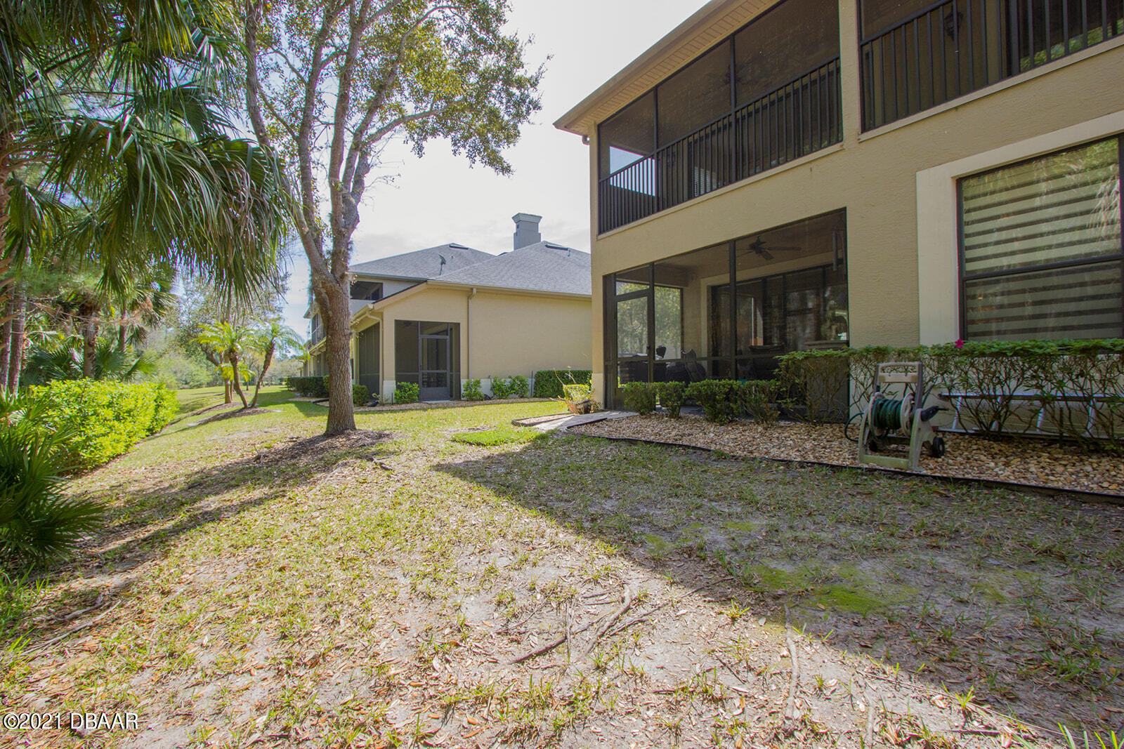 751 Cobblestone Way Ormond Beach, FL 32174 - Photo 54 of 63 a view of a house with a tree in front