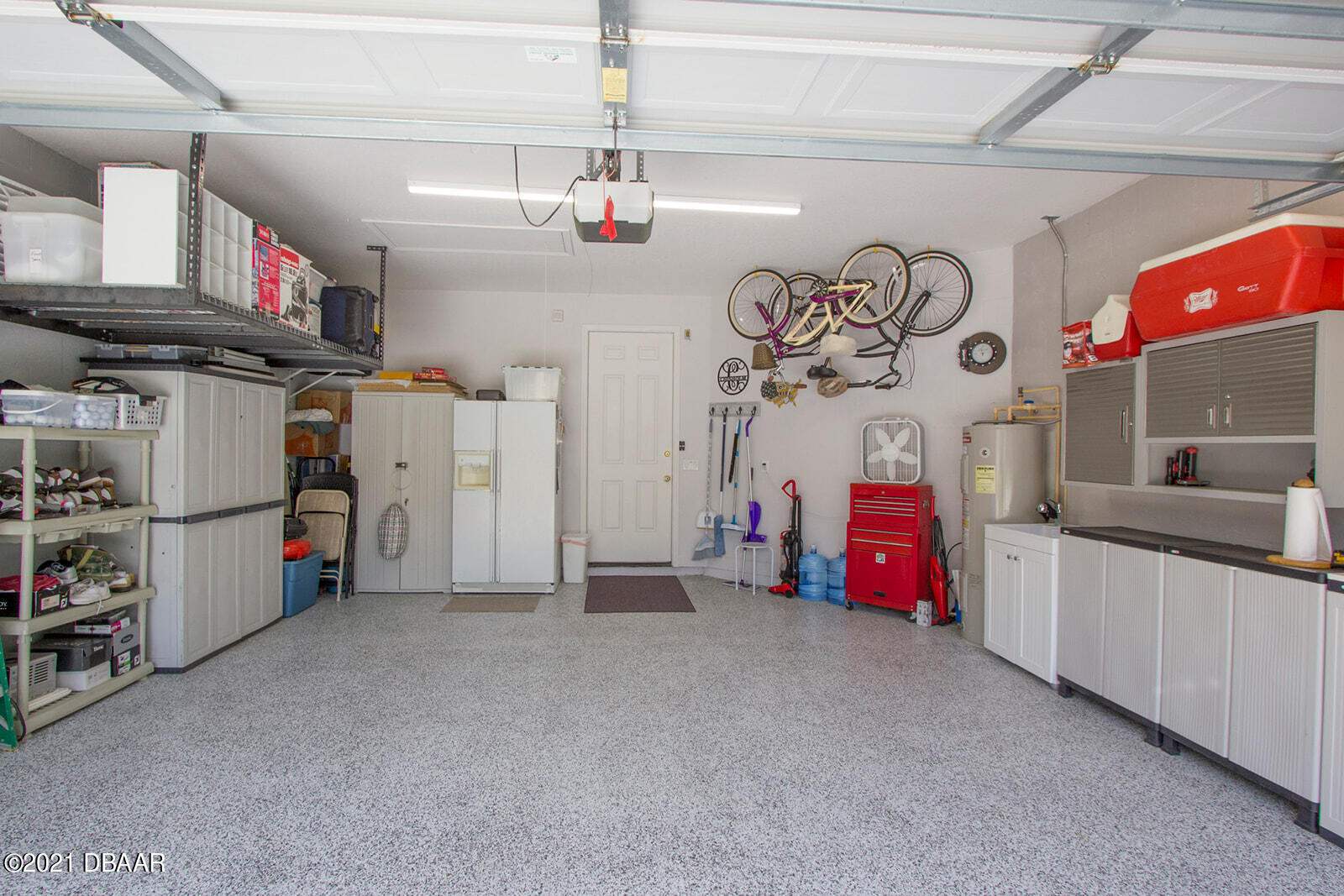 751 Cobblestone Way Ormond Beach, FL 32174 - Photo 58 of 63 a view of a garage with furniture and a chandelier