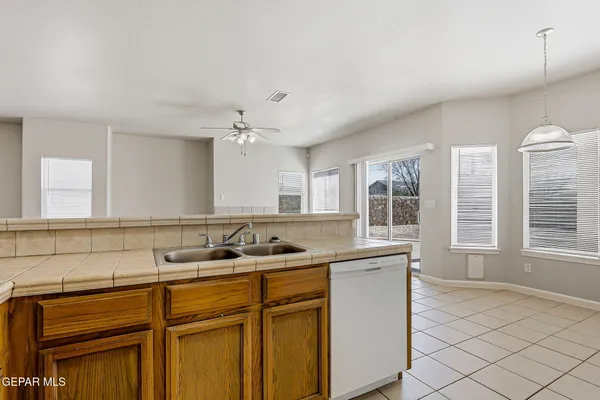 a kitchen with a sink and cabinets