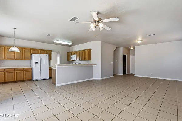 a view of a kitchen with microwave and cabinets