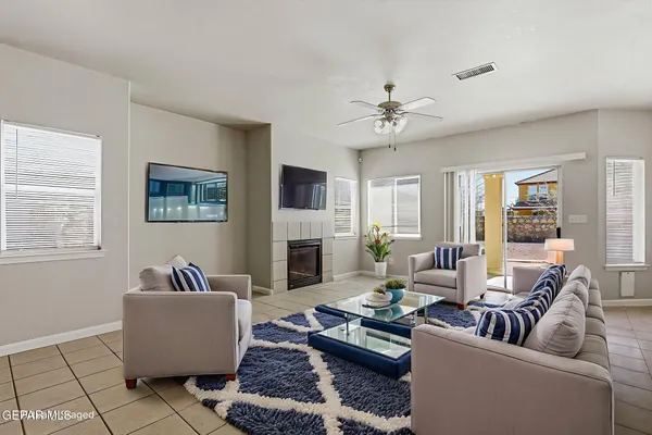 a living room with furniture and a fireplace