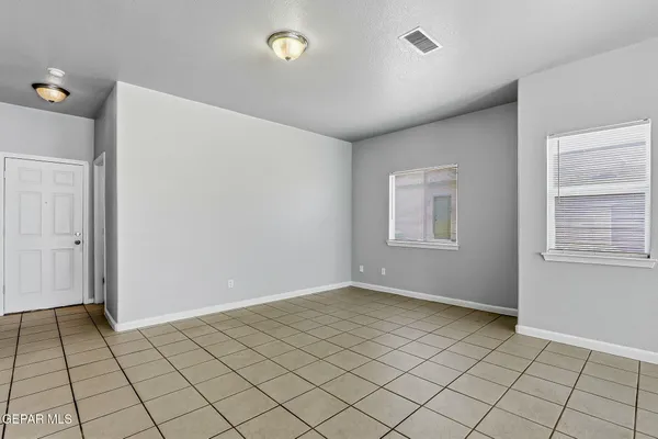 a view of an empty room and window