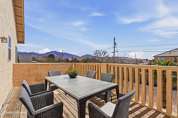 a view of a balcony with furniture