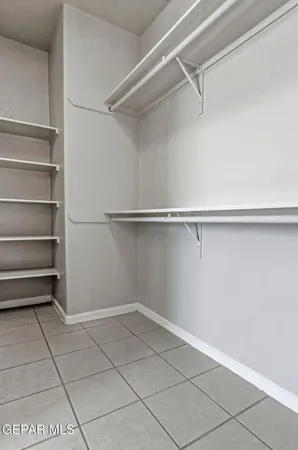 a view of an empty walk in closet