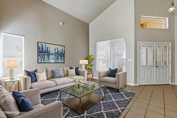 a living room with furniture and a rug